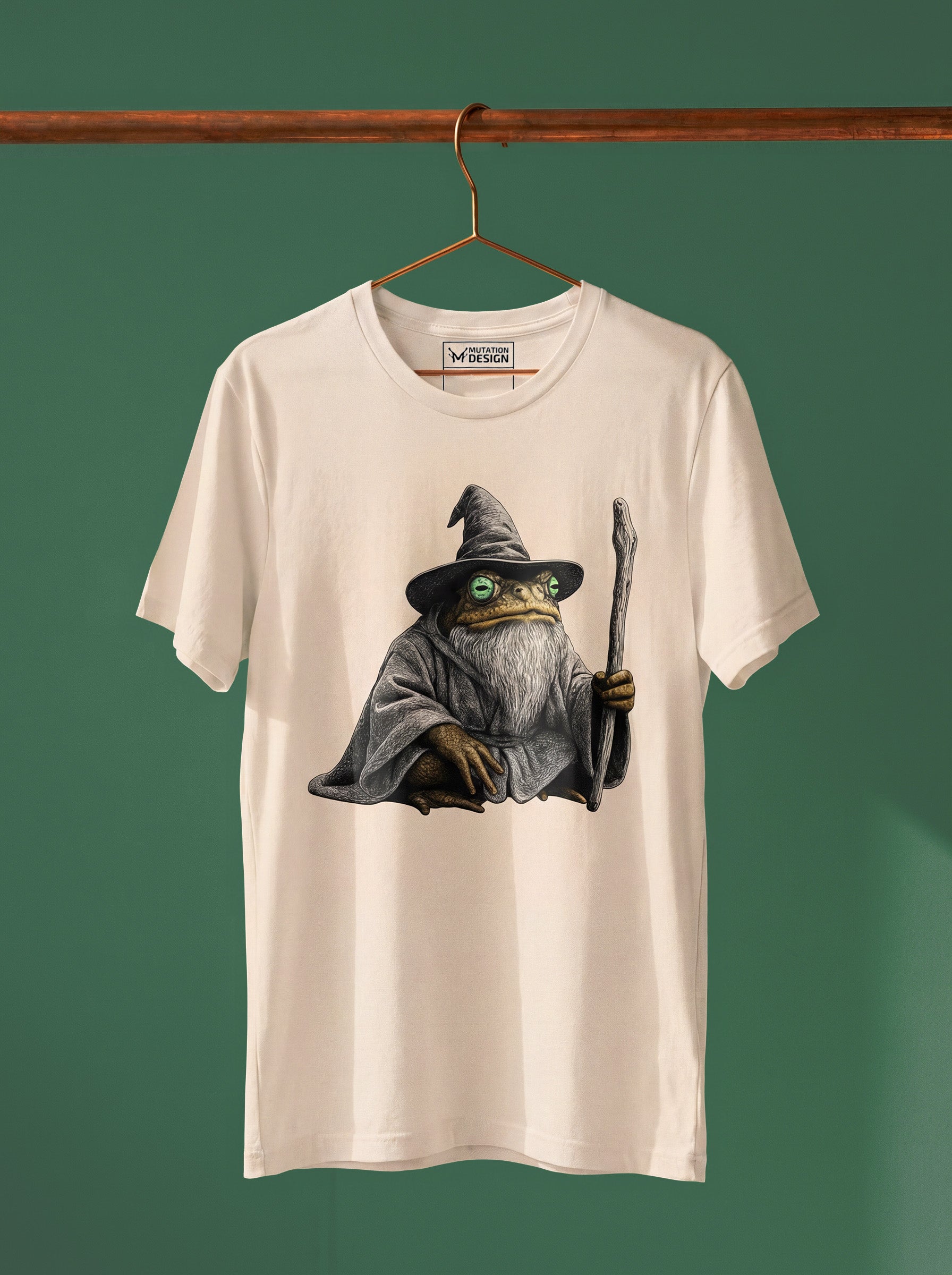 T-shirt with a graphic of a character in a wizard hat and robe on a hanger against a green background.